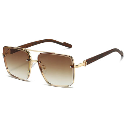 Sunglasses with gold frame and brown gradient lenses on a white background