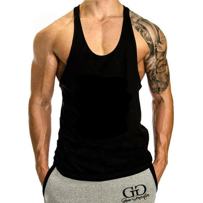 Person wearing a black tank top and gray shorts with a visible brand logo on a white background