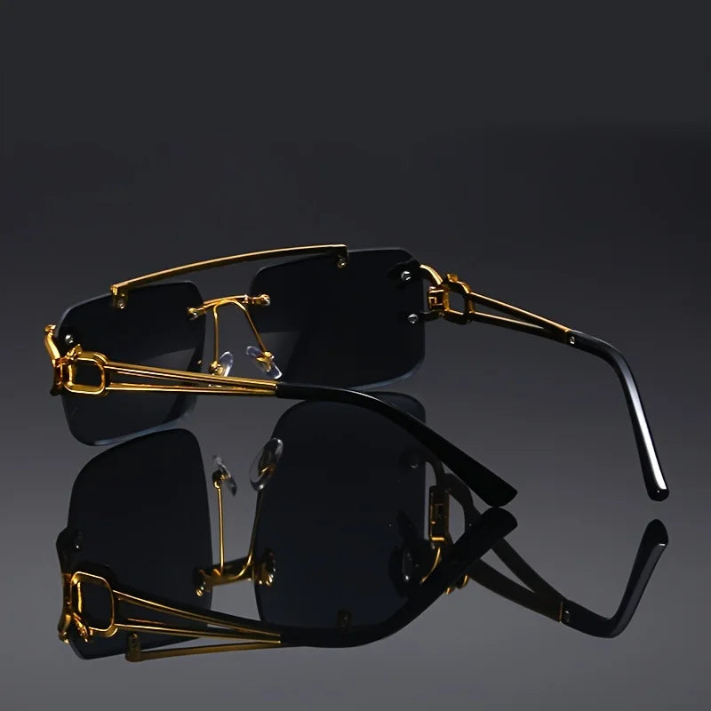 Black sunglasses with gold frames on a reflective black surface