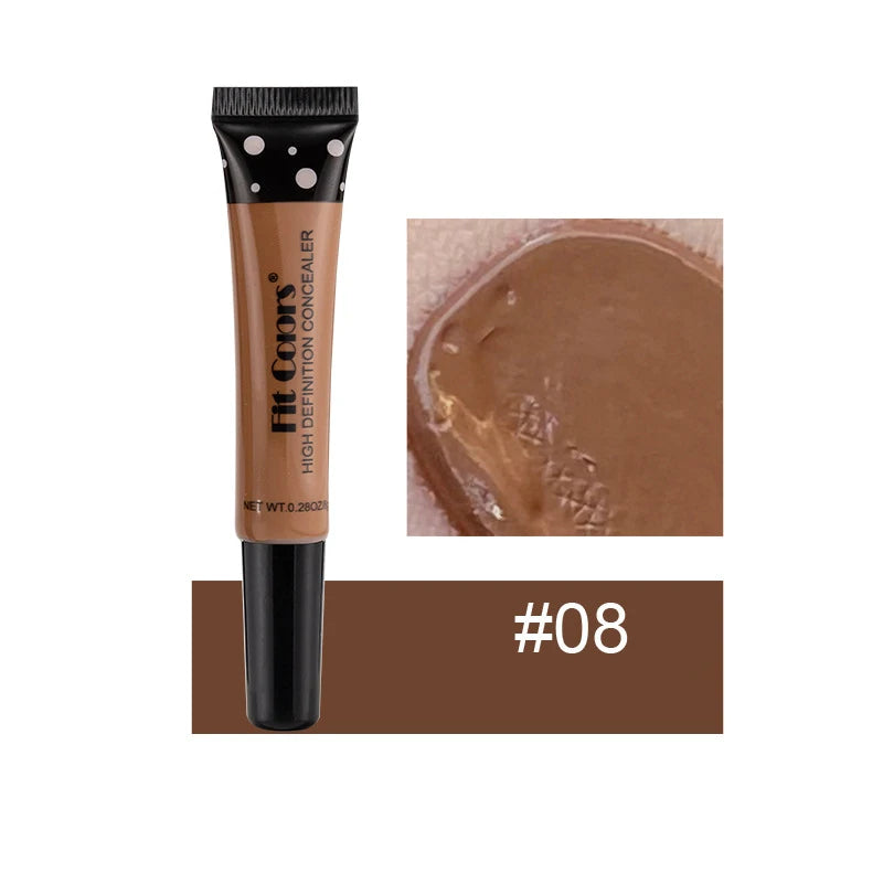 Concealer tube with applicator and swatch on a white background