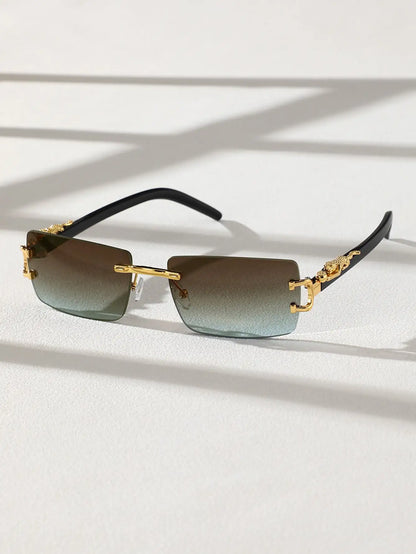 Sunglasses with gold frames and gradient lenses on a light background
