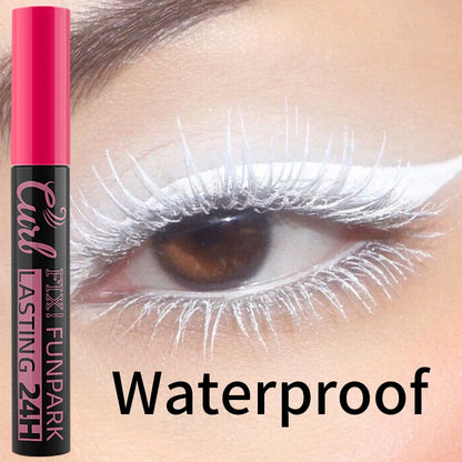 Eyelash curler with pink and black packaging on a close-up of an eye with white eyelashes.