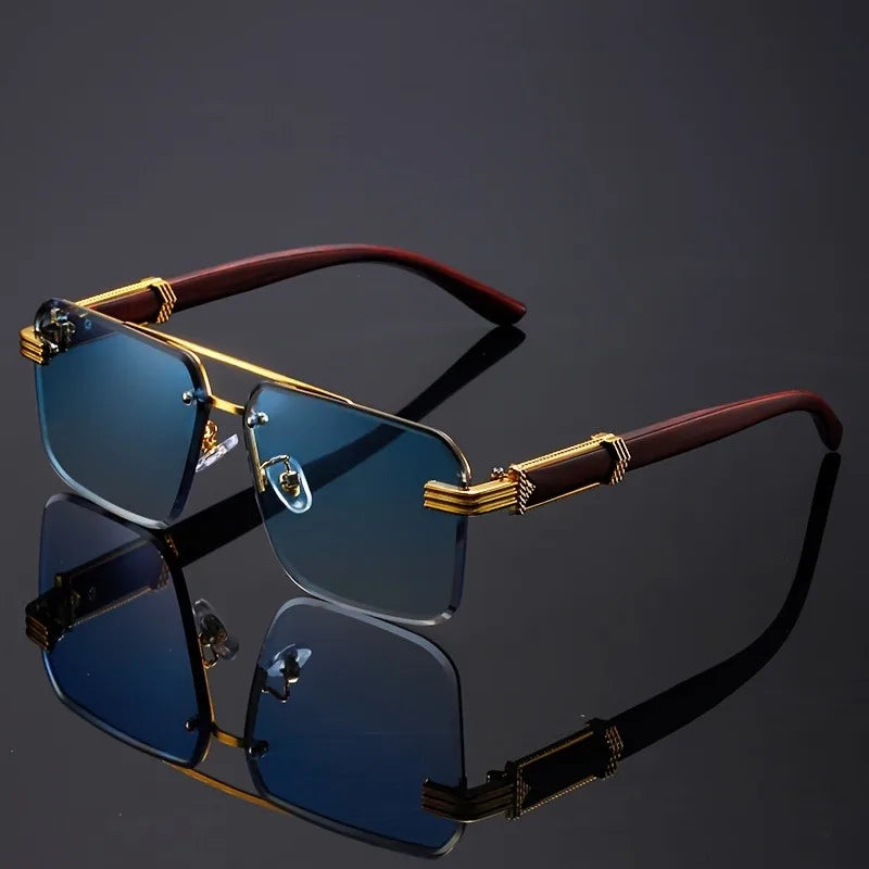 Sunglasses with gold and red frame on a reflective black surface