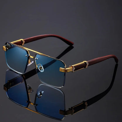 Sunglasses with gold and red frame on a reflective black surface