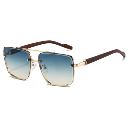 Sunglasses with gold frame and brown arm on a white background
