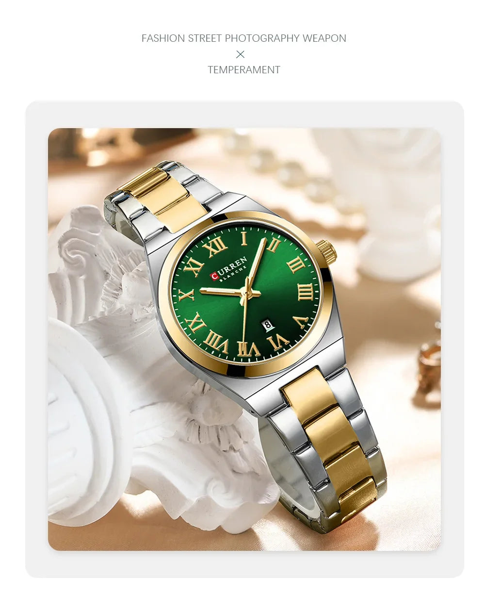 Watch with green dial and gold and silver band on decorative surface