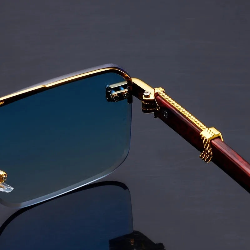 Gold-framed sunglasses with a dark background