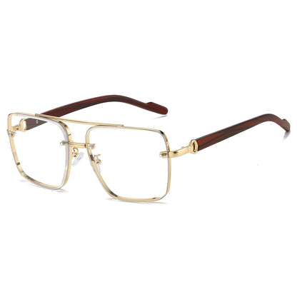 Gold-framed eyeglasses with brown accents on a white background