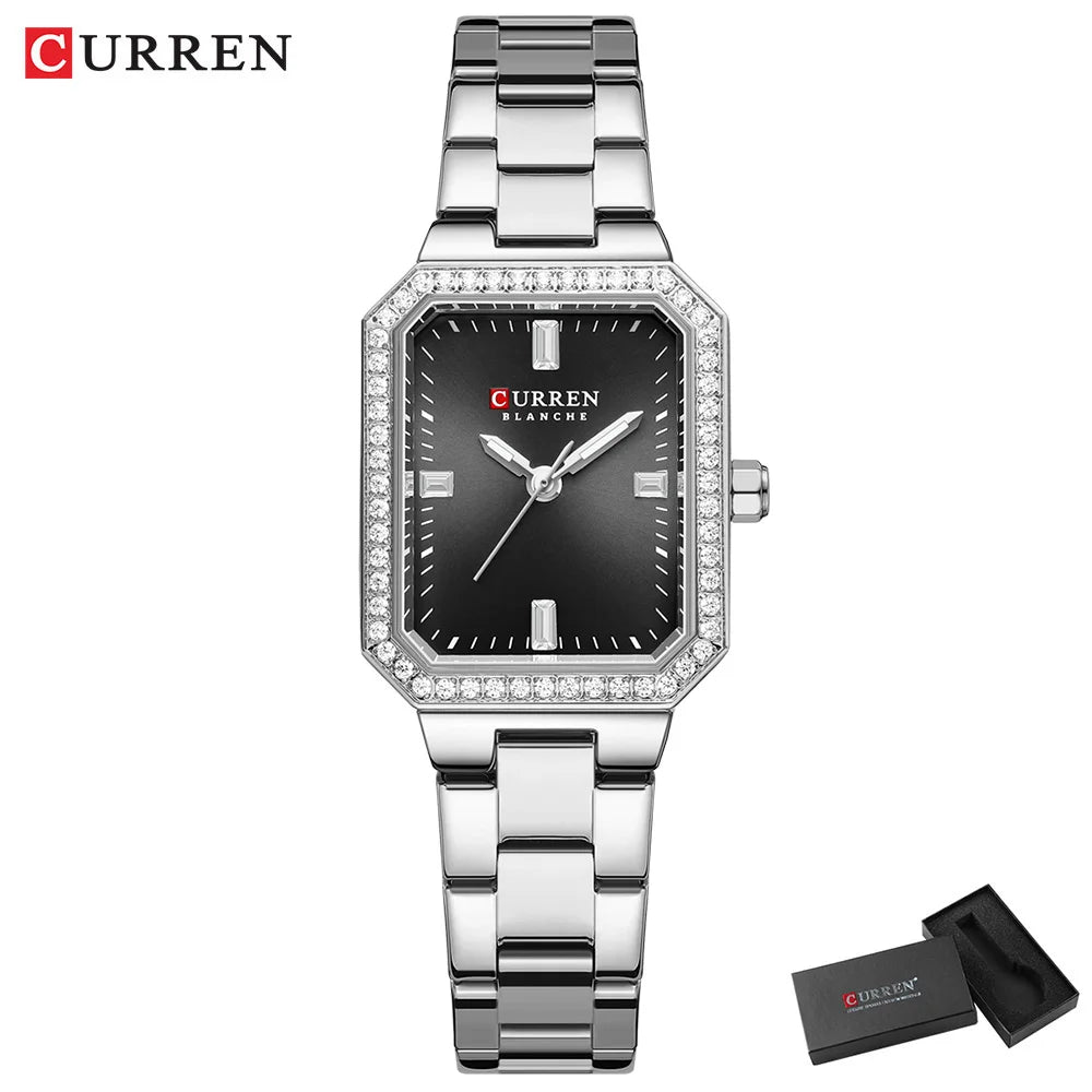 Silver Curren watch with black face on a white background