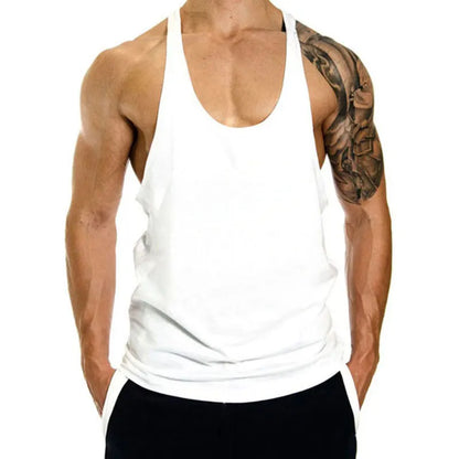 Person wearing a white tank top with a tattooed arm on a white background