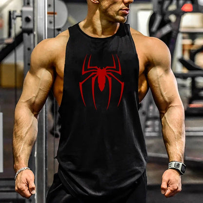 Person wearing a black tank top with a red spider logo in a gym setting