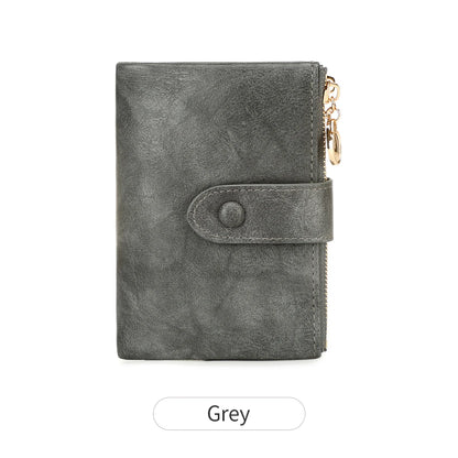 Gray wallet with a gold zipper on a white background