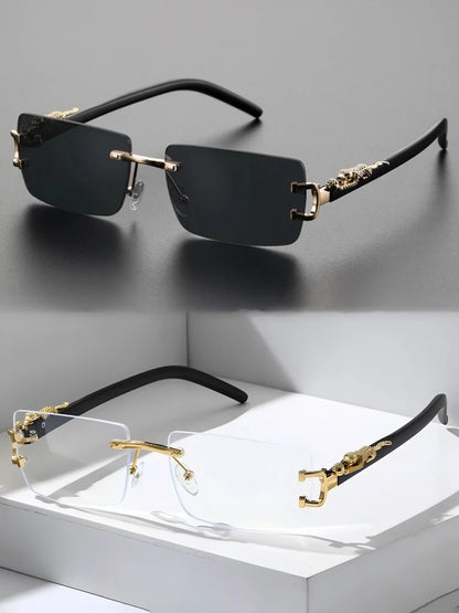 Black and gold rimless sunglasses on a gray background