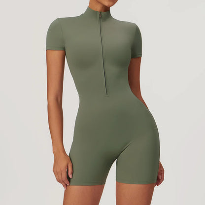 Green bodysuit worn by a model on a light gray background
