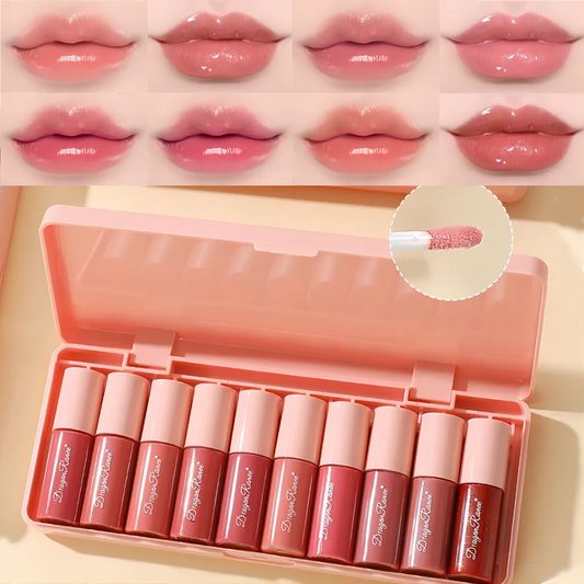 Set of lip glosses in a pink case with swatches above on a beige background