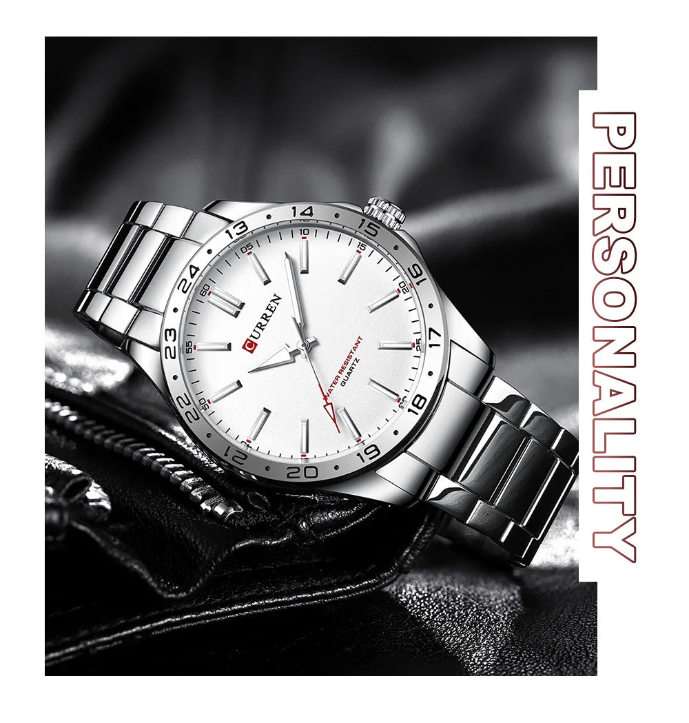 Silver wristwatch with white dial on a dark textured background