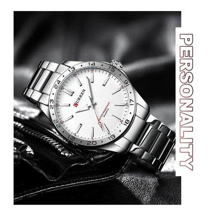 Silver wristwatch with white dial on a dark textured background