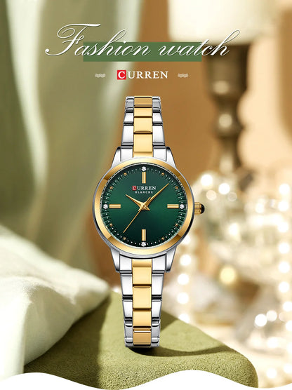 Two-tone silver and gold watch with green face on a soft surface, brand 'Curren' visible.