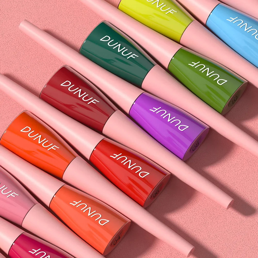 Set of DUNUF lip glosses in various colors on a pink background
