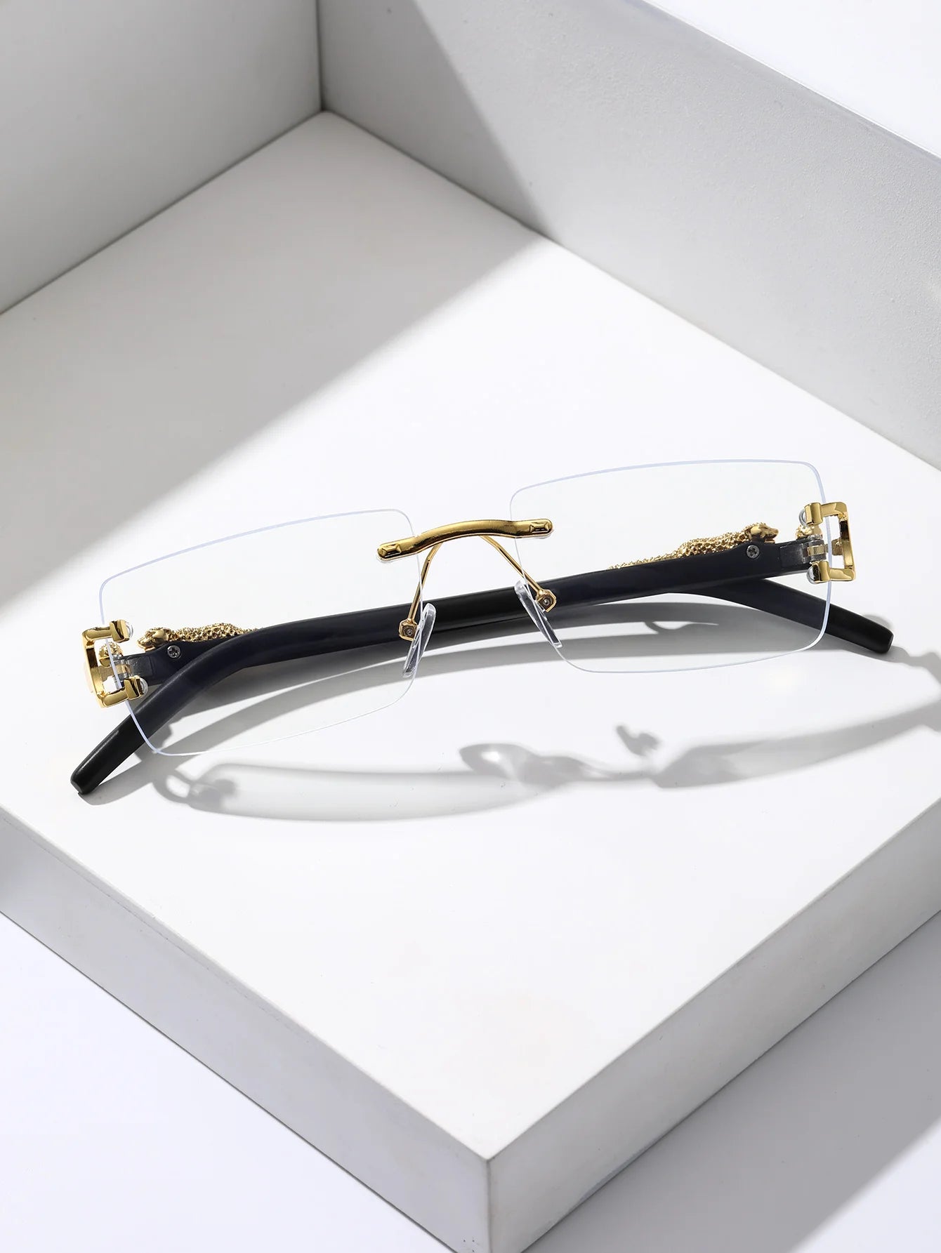 Eyeglasses with gold accents on a white background