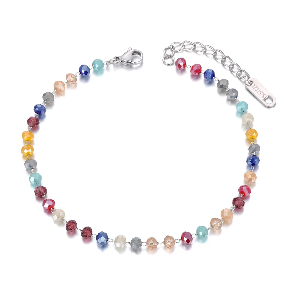 Multicolored beaded bracelet with silver clasp on a white background