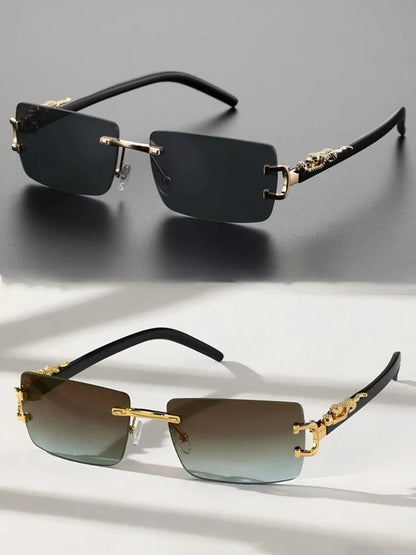 Two pairs of sunglasses with gold and black frames on a gray and white background