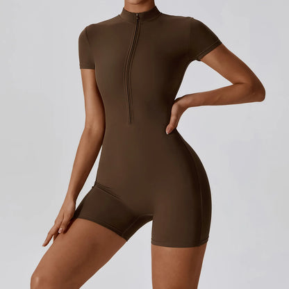 Brown bodysuit worn by a model on a plain background