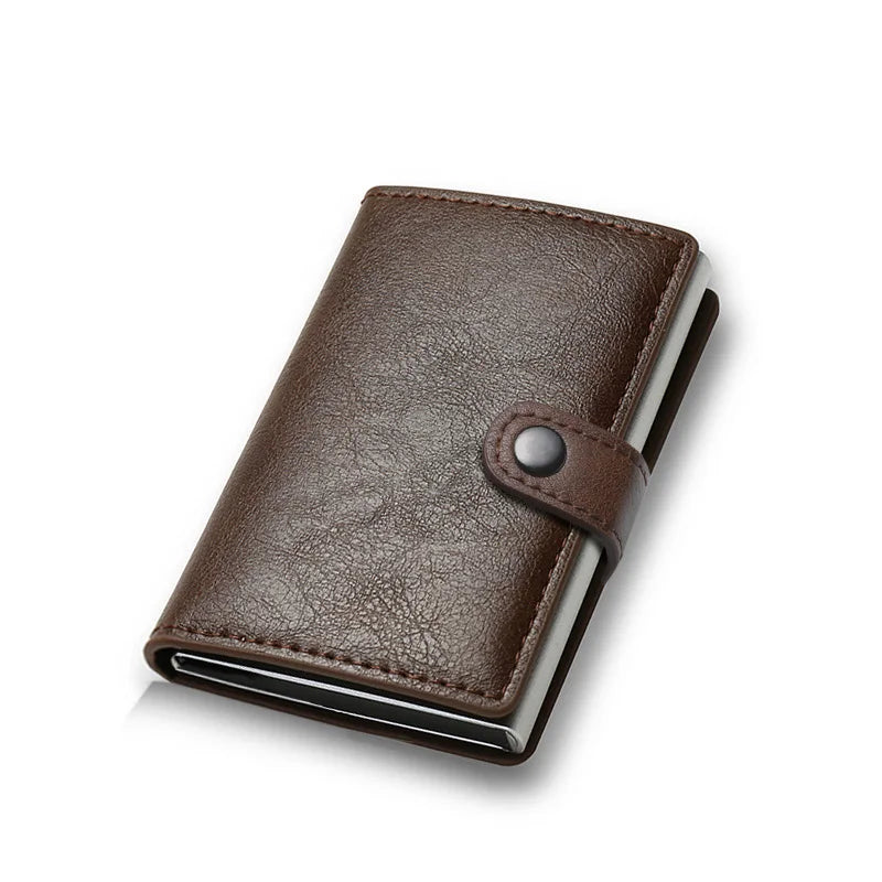 Brown leather wallet with a metallic button on a white background