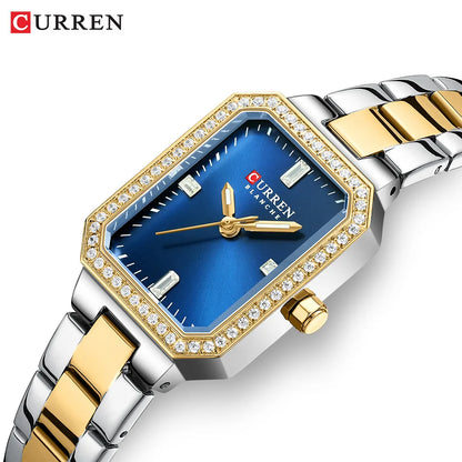 Luxury watch with gold and silver band and blue face on a white background, featuring the brand 'Curren'.