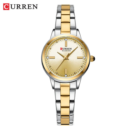 Curren watch with gold and silver band on a white background