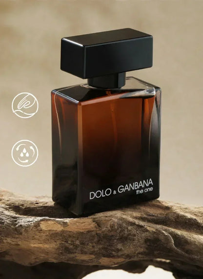 Perfume bottle labeled 'Dolo & Ganbana' on a wooden surface with a beige background