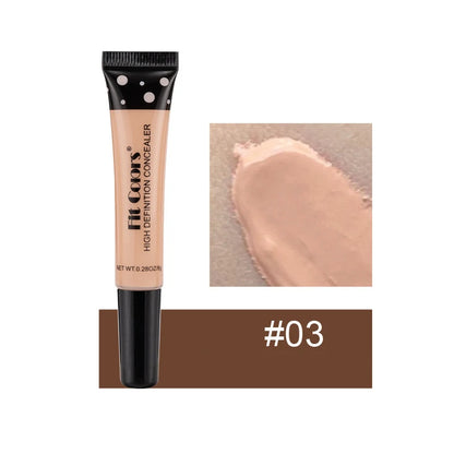 Concealer tube with applicator and swatch on a white background