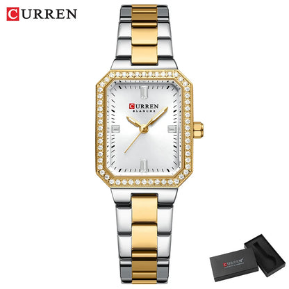 Gold and silver Curren watch with white face on a white background