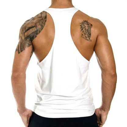 Person wearing a white tank top with tattoos on arms and back