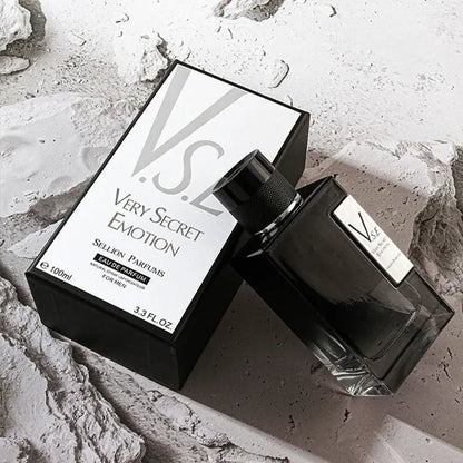 Black perfume bottle and packaging labeled 'Very Secret Emotion' on a textured surface.