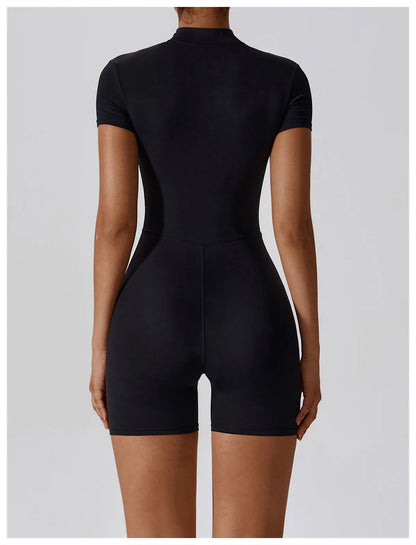 Black bodysuit worn by a model on a light gray background