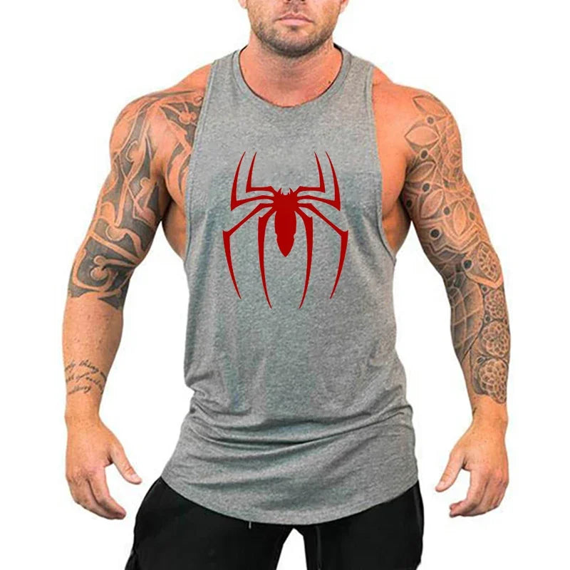 Man wearing a gray tank top with a red spider logo on a white background