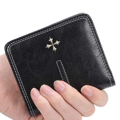 Black leather wallet with a star emblem held by a hand on a white background