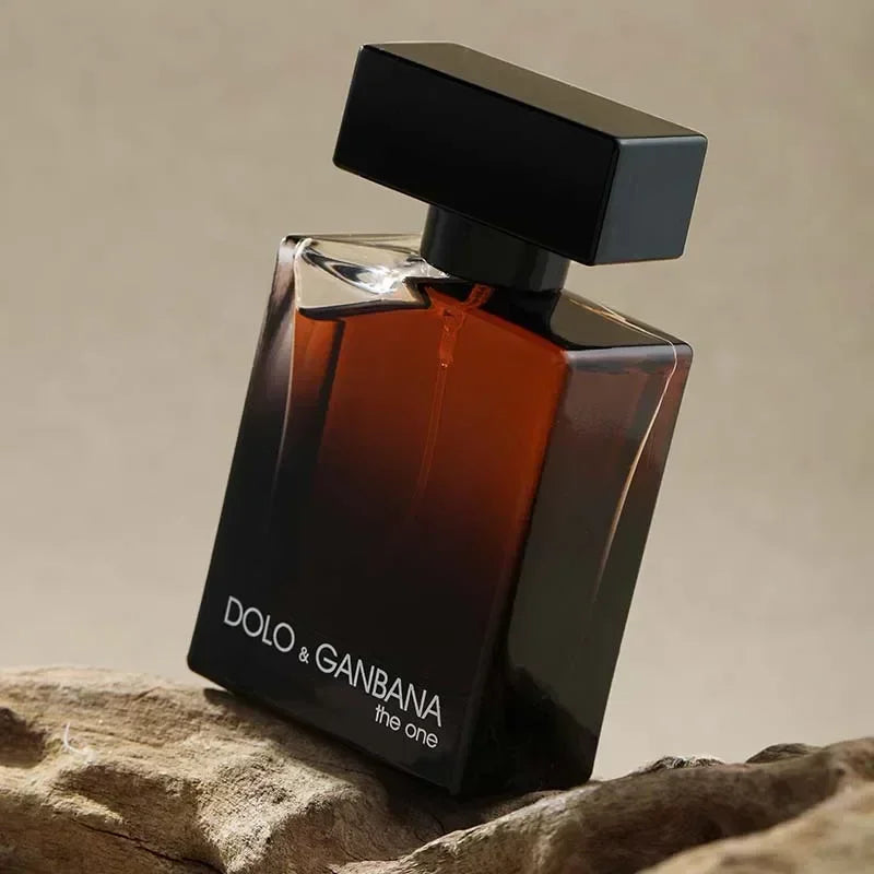 Perfume bottle labeled 'Dolo & Ganbana' on a textured surface with a neutral background
