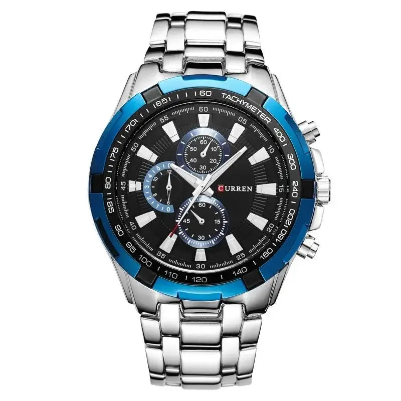 Silver watch with a black and blue face on a white background