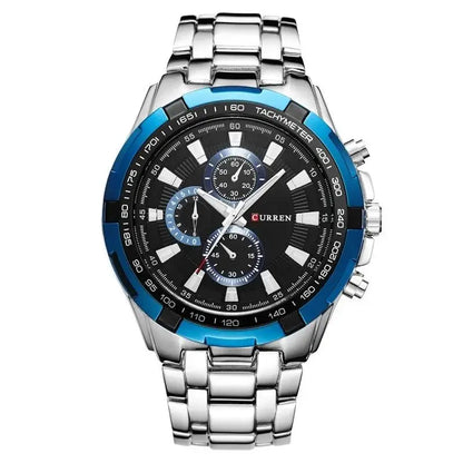 Silver watch with a black and blue face on a white background