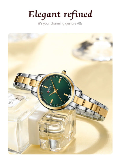 Elegant watch with gold and silver band on a white background