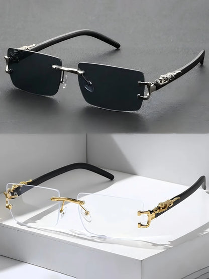 Two pairs of sunglasses on a gray surface with a white box underneath.