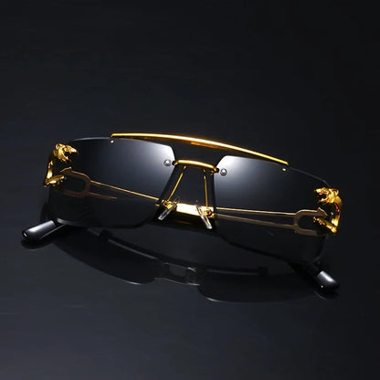 Gold-framed sunglasses with black lenses on a dark background