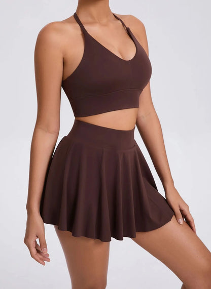 Brown sports bra and skirt set on a white background