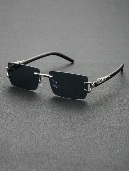 Sunglasses with thin frame and reflective lenses on a gray background