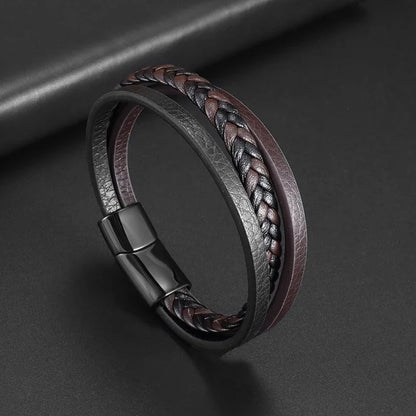 Braided leather bracelet with a magnetic clasp on a dark background