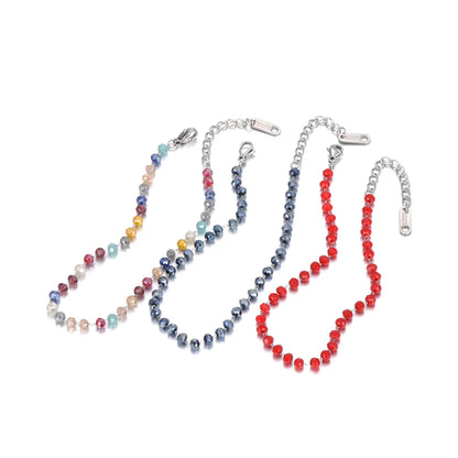 Three beaded necklaces in different colors on a white background