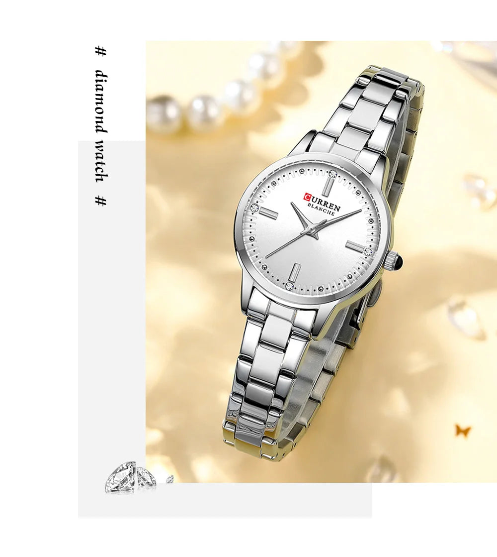 Silver wristwatch with a white face on a decorative background