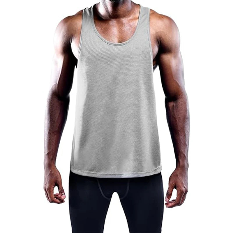 Person wearing a gray tank top on a white background